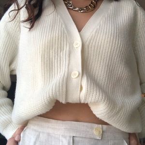 trendy cardigan ( looks like it was hand knitted)
